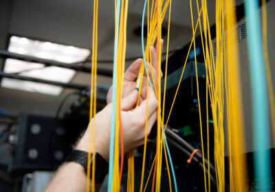 hands working on cables