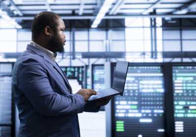 IT staff member working in data center housing storage