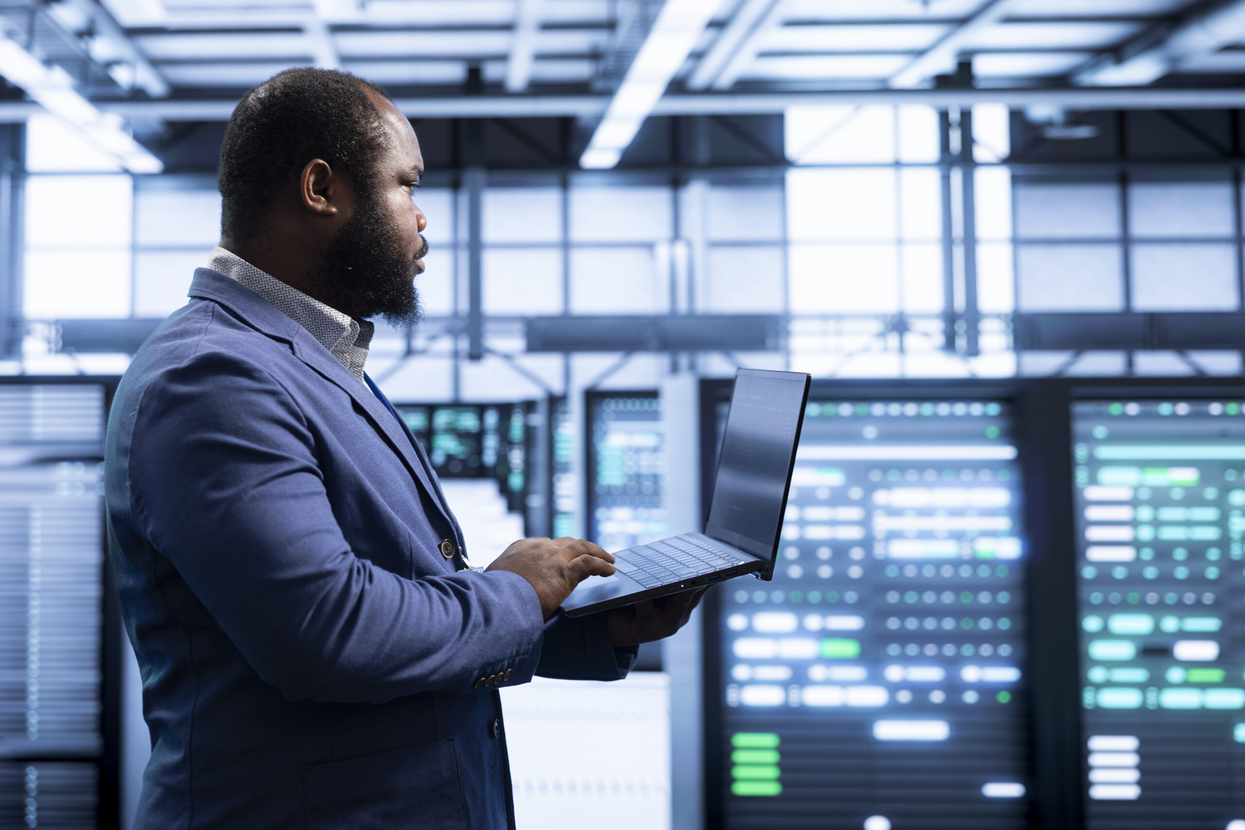 IT staff member working in data center housing storage
